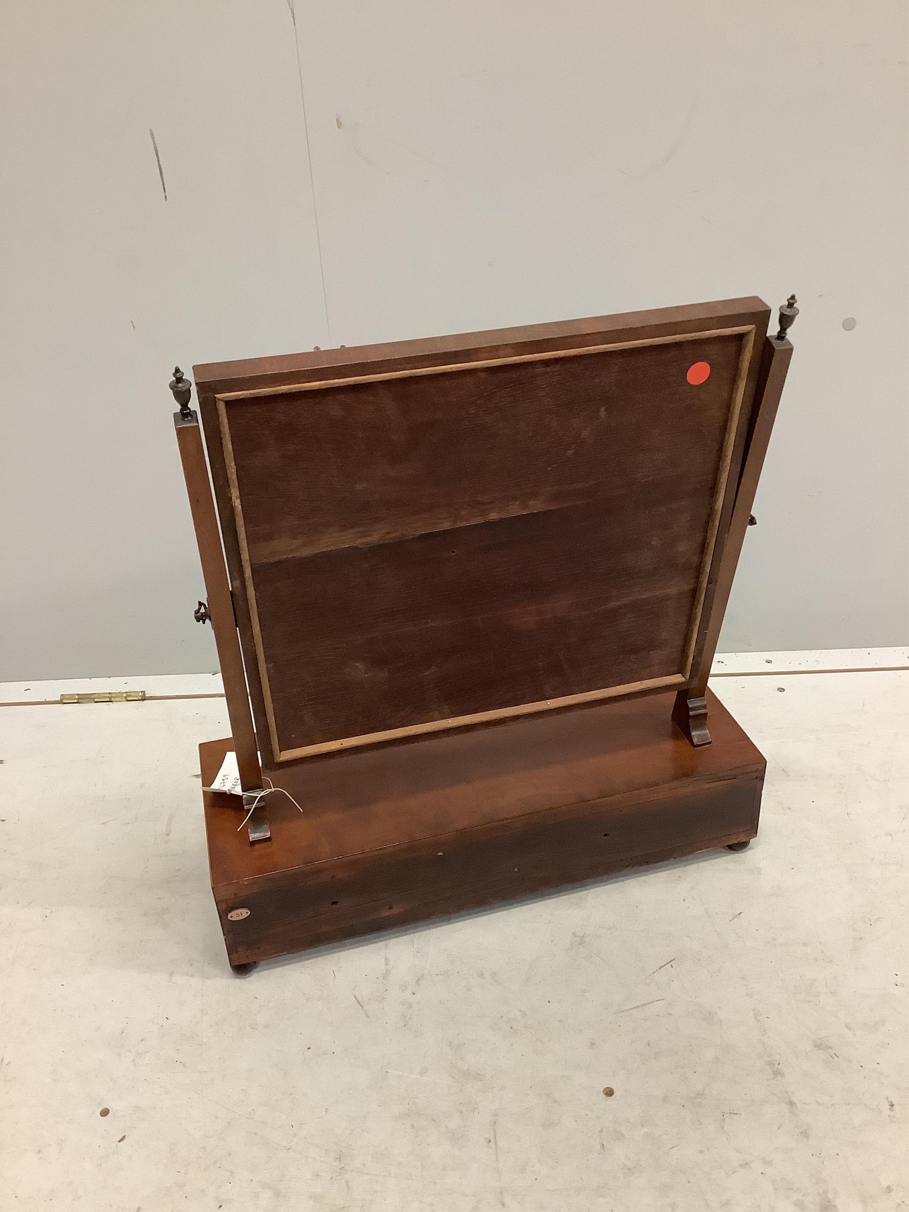 A George III mahogany toilet mirror with rectangular plate on breakfront three drawer box base, width 55cm, depth 22cm, height 62cm. Condition - fair